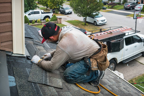 Professional Roofing technician working in Tyngsboro, MA